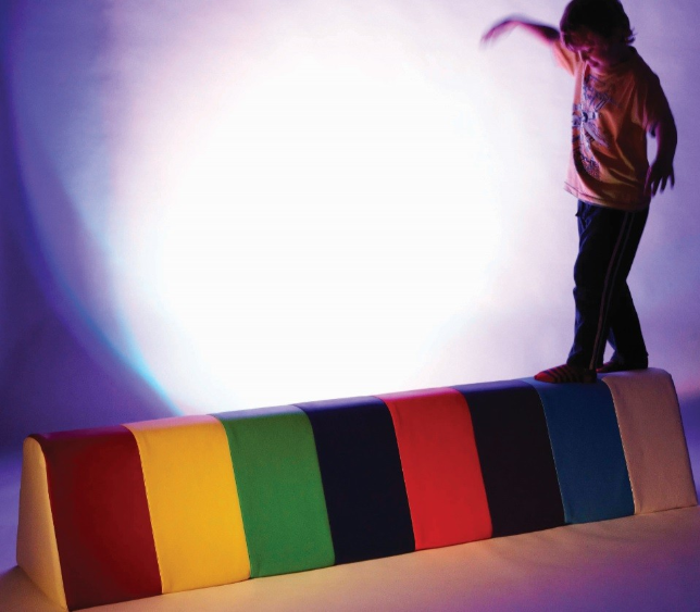 child walking on balance beam